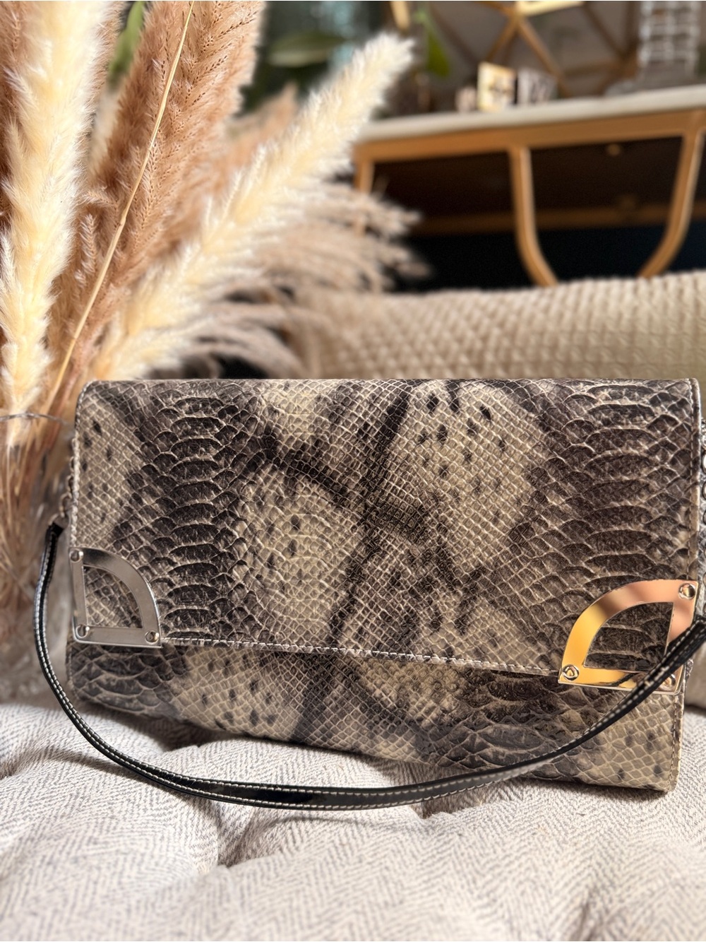 Charles and Keith Snake-Embossed Clutch in Taupe and Black with Metallic Accents